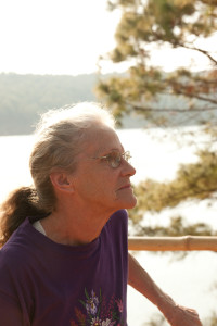 Red Cross Donut Dollie Dorset (Hoogland) Anderson captured in an introspective moment at Pleiku Lake, Vietnam