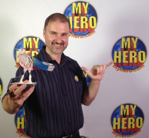 Norm Anderson posing with the award made by Senegalese artist Mamadou Tall Diedhiou, which we received from the 2015 My Hero International Film Festival for 1st place in the "Indy Features in Development” category